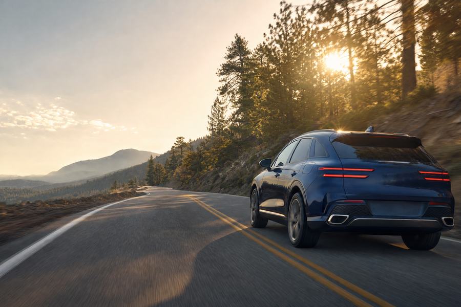 SUV on a forest road at golden hour